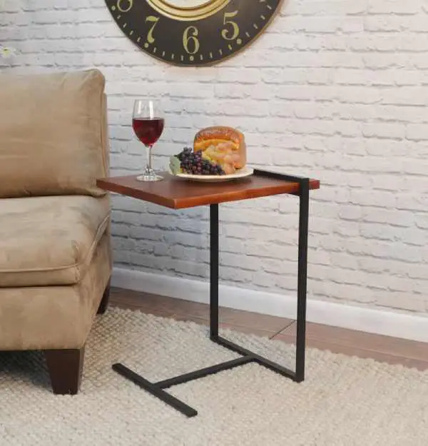 The industrial-style Nessa Accent Table tucks neatly under the sofa thanks to its T-frame that fits snugly against your sofa's armrest. 