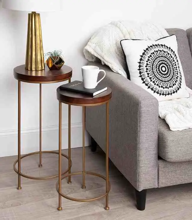 nesting side tables composed of wood and framed in a metal base