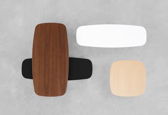 Overlapping coffee tables with rounded corners and tapered legs