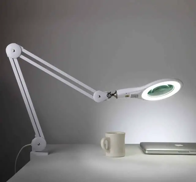 Brightech Clamp Lamp is a reading lamp that magnifies as well as illuminates thanks to its bright LED light and magnifying lens. 