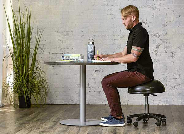 The hydraulic height-adjustable Gaiam balance ball chair is perfect for office, home and classroom.