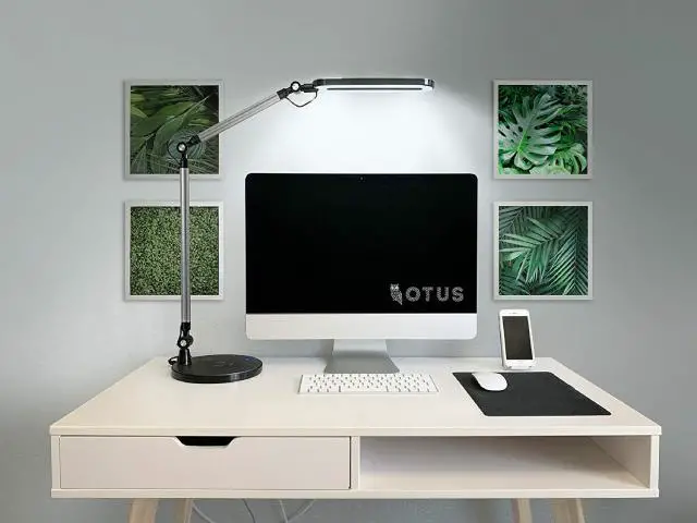 OTUS LED Desk Lamp with its adjustable swivel arm, sports three color modes and a variety of dimmer settings. In addition, you can wireless charge your phone with the lamp.