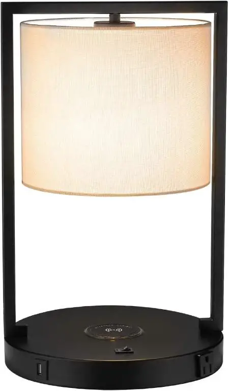 LMS modern wireless charging bedside lamp has also a built-in power outlet and USB port.